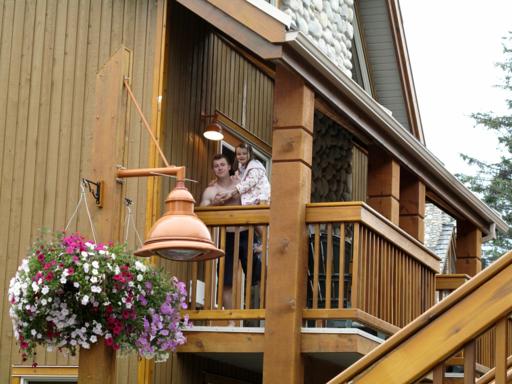 a man carrying little girl at the veranda of the condo