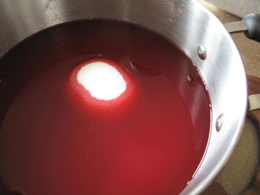 extracted cranberry juice in a pot