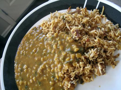 heated package of lentils and spinach over the rice in a plate