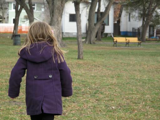 little girl walking in the park