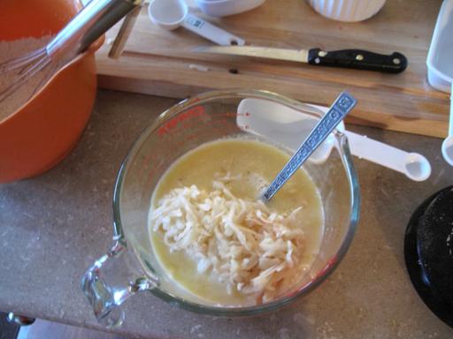 mixing together the egg, milk, vanilla and apples in a Pyrex measuring cup