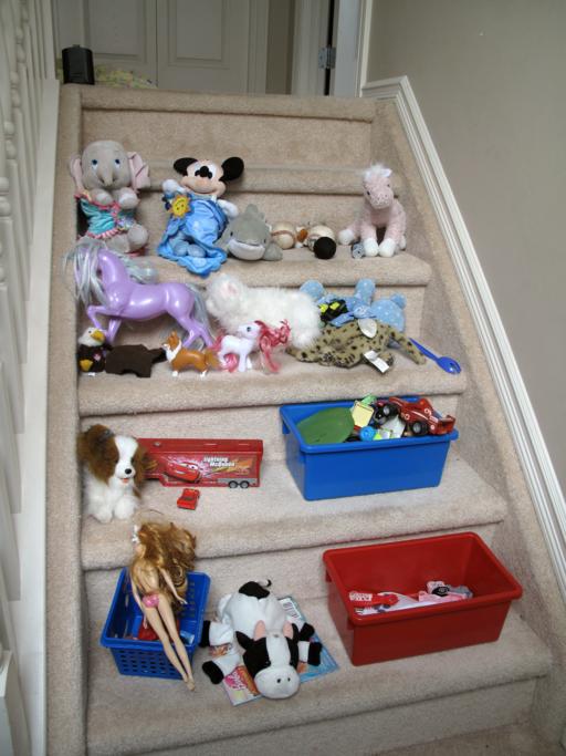 kid's toy in every stair of the house