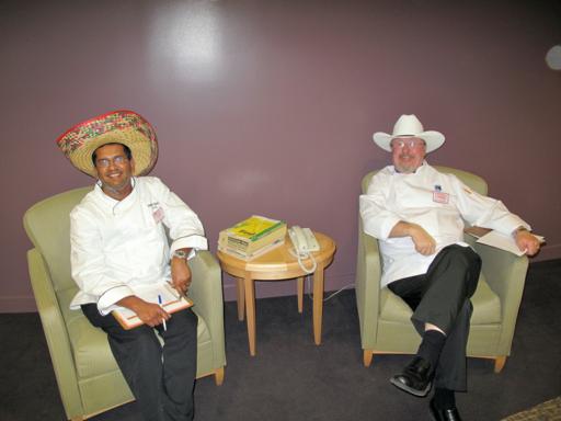 two gentleman sitting in the couch