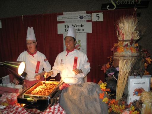 the Westin booth with two chefs in their white uniforms