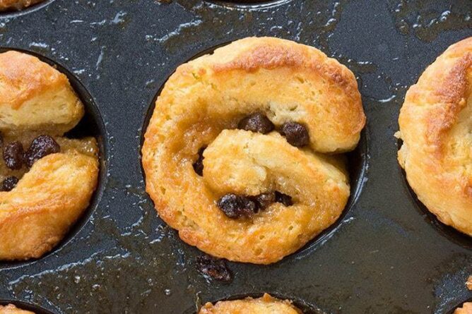 close up of Cinnamon Buns with raisins in muffin tins
