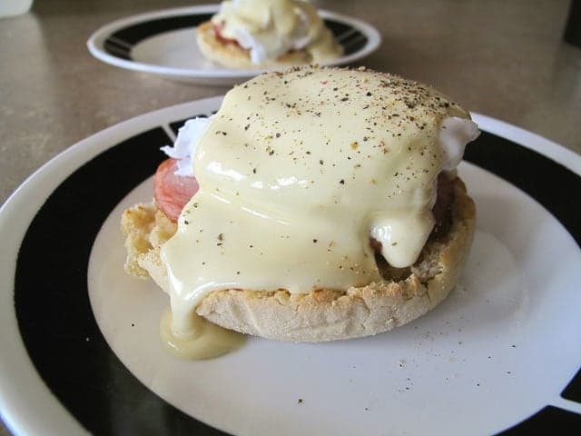 Easy eggs benedict topped with hollandaise sauce