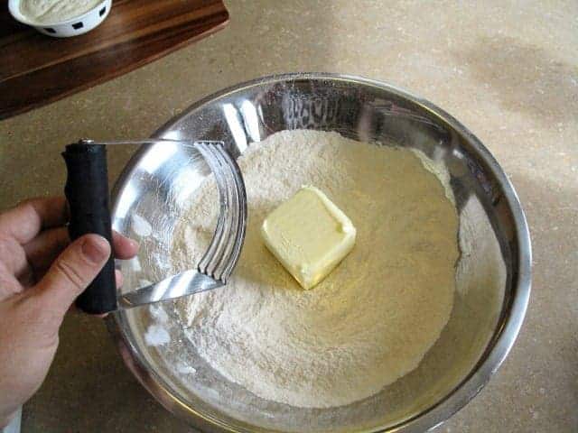 cutting the butter using pastry blender into the dry mixture