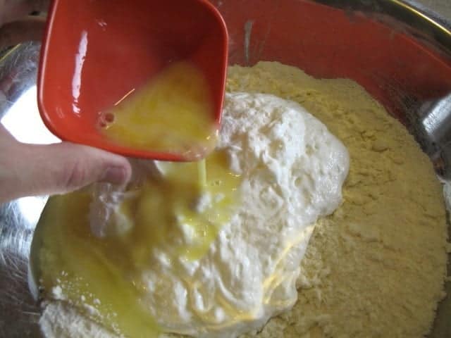 adding the beaten egg into the dry ingredients mixture
