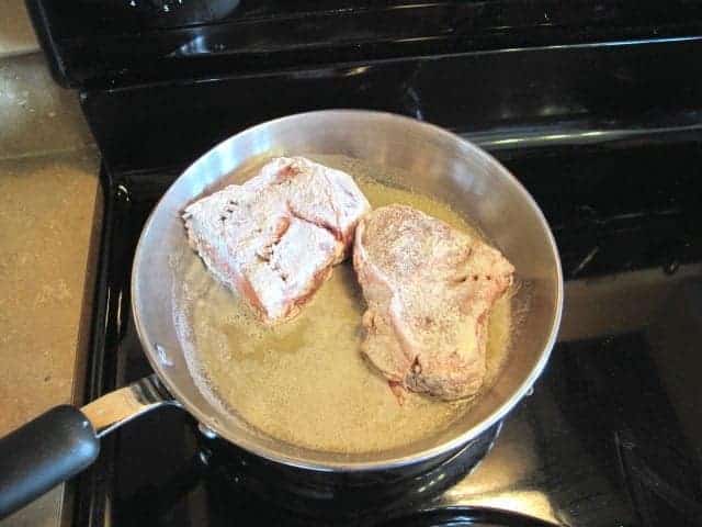 frying the flour Steak in a pan with oil and melted butter
