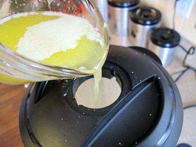 pouring the very hot butter into the blender