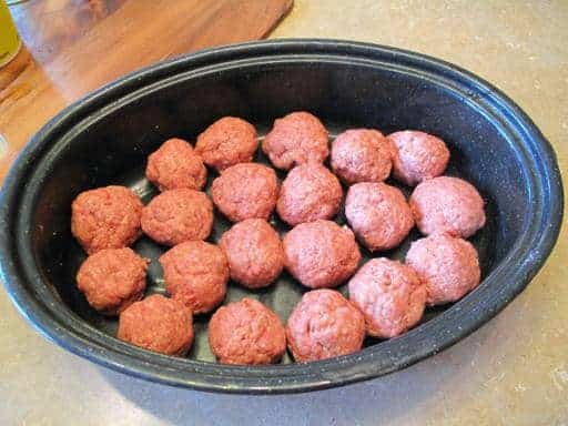 meatballs on baking pan ready for cooking