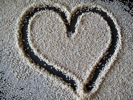 sesame seeds on a tray with heart shape art