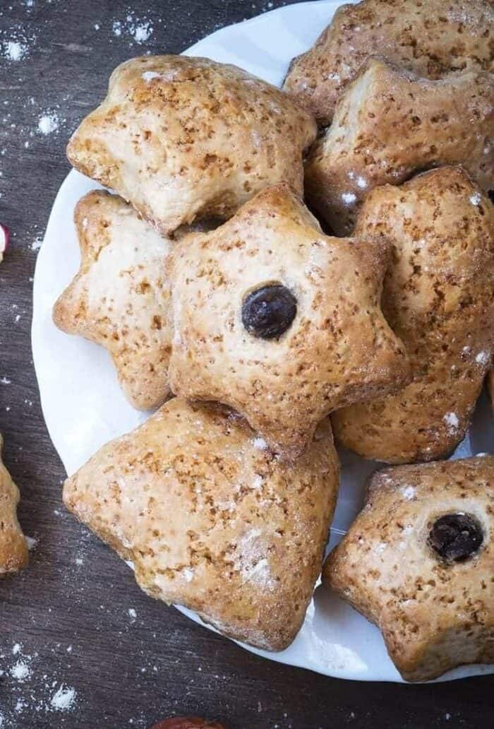 ginger tea scones in cute little tree and star shapes with Christmas cherry in the center