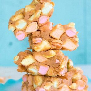 Close up stack of No Bake Peanut Butter Marshmallow Squares in a ruffle plate