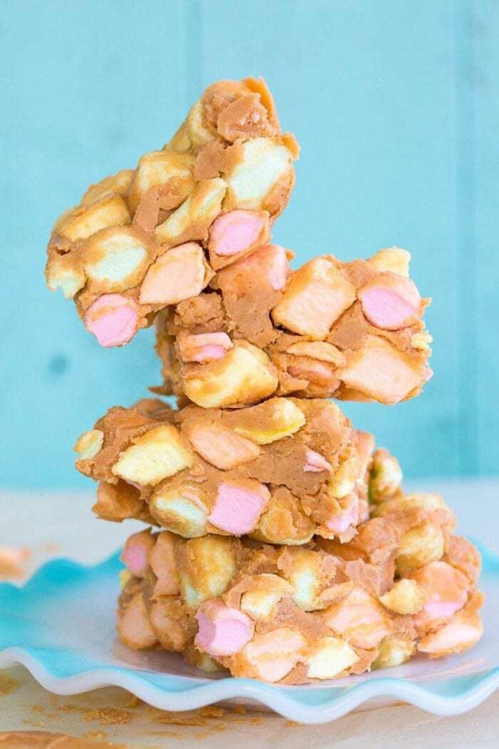 Close up stack of No Bake Peanut Butter Marshmallow Squares in a ruffle plate