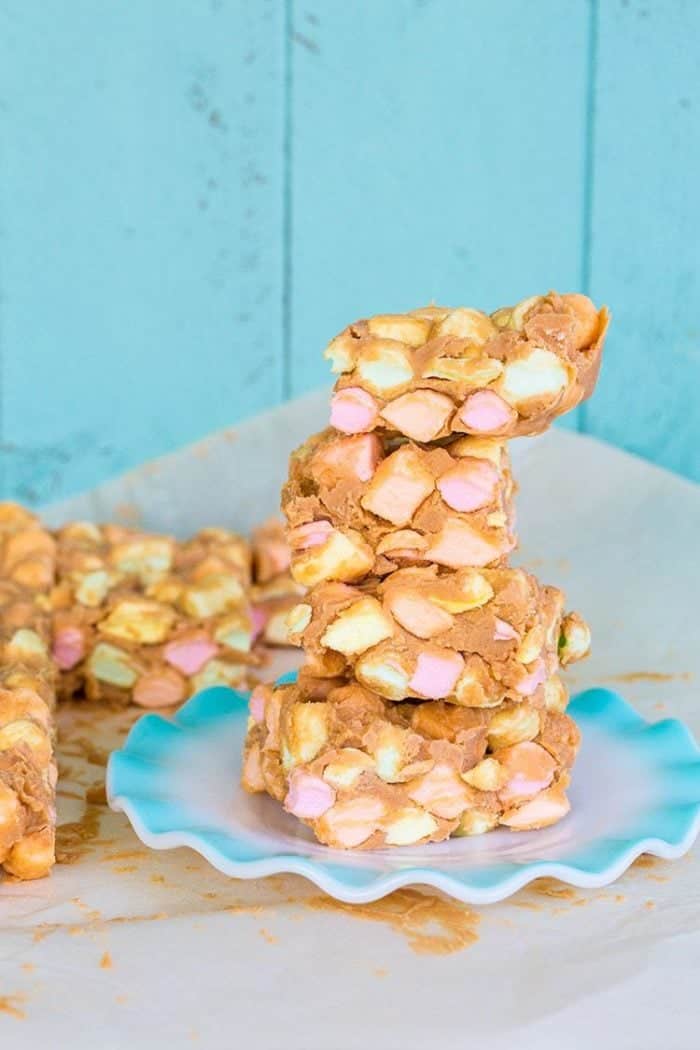 Close up stack of No Bake Peanut Butter Marshmallow Squares in a ruffle plate