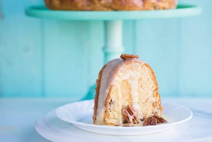 a slice of Pecan Butter Rum Cake in a white dessert plate