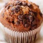 close up of Ultimate Chocolate Chip Pumpkin Muffin in a white cupcake liner