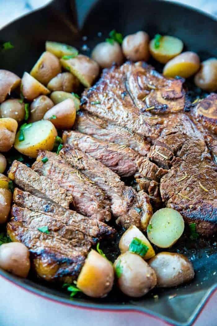 sliced Marinated then Barbecued T-Bone steak with sliced mini potatoes