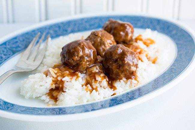 Sweet and Sour Meatballs in a plate with rice 