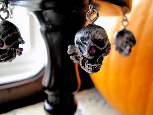 close up of hanging purple rhinestone skulls