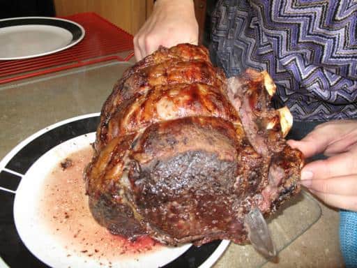 removing the bones of cooked prime rib