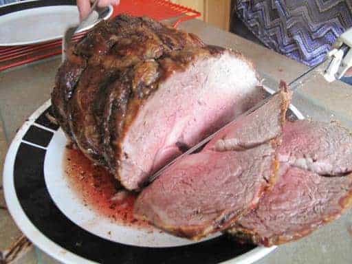 slicing the roasted prime rib 