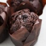 close up Chocolate Zucchini Cupcakes with brown cupcake liners on white background