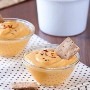 Pumpkin dip made with cream cheese, some graham crackers on background