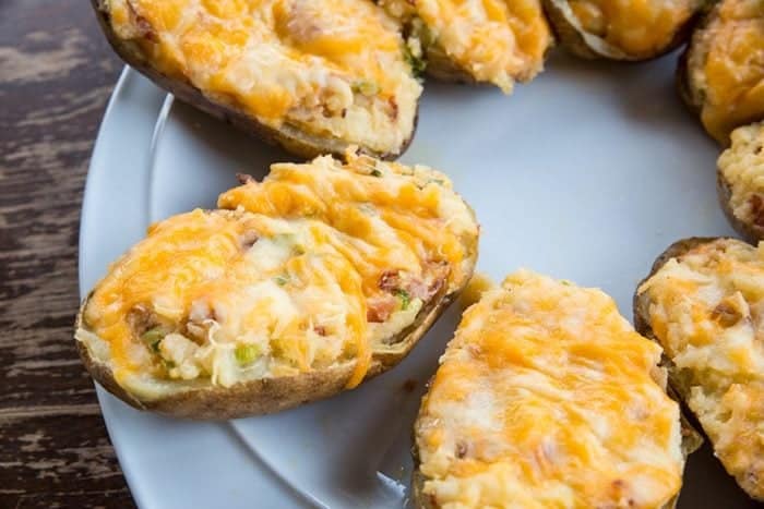 Twice baked potatoes on white plate