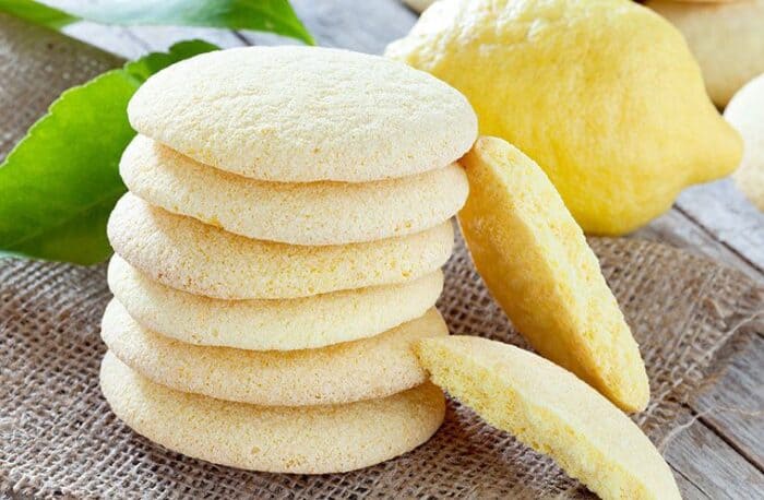 Stack of Lemon Sugar Cookies, fresh lemon on the side