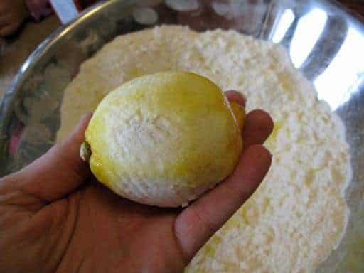 holding a lemon with peel grated