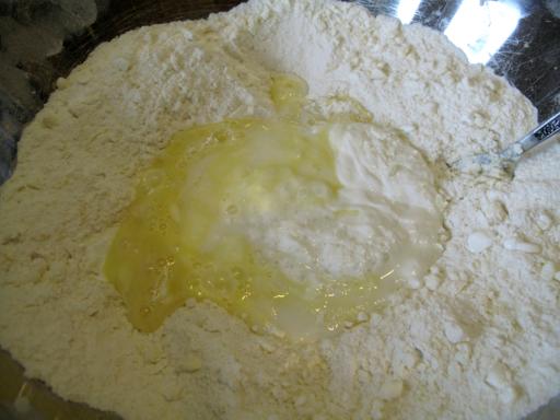 Mixing the sour cream, milk and egg into the dry ingredients