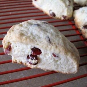 pieces of Lemon Cranberry Scones in a red cooling rack