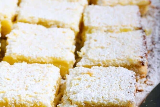 close up slices of Lemon Bars with icing sugar on top