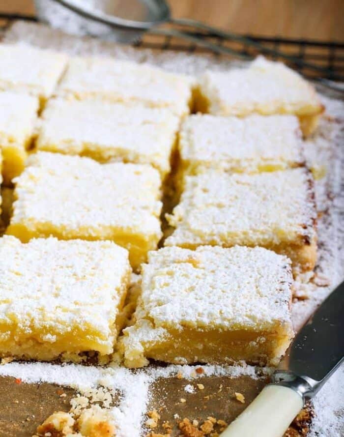 close up slices of Lemon Bars with icing sugar on top