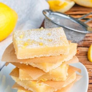 stack of Creamy Lemon Bar slices with shortbread crust