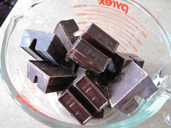 chocolate squares in a Pyrex glass ready for melting