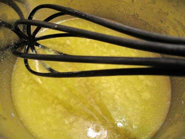 black whisk in a melted butter