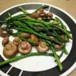 seared mushrooms and asparagus in a plate