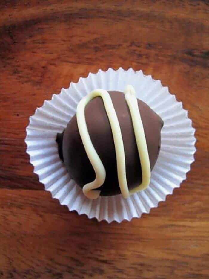 Chocolate Truffles with white chocolate topping on a cupcake liner