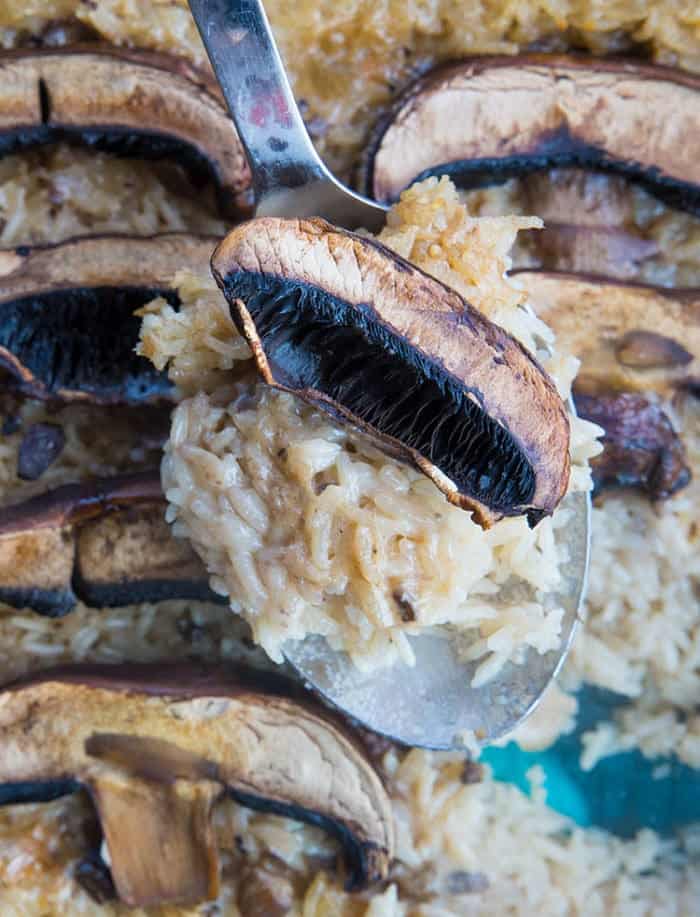 Rice & Mushroom Casserole with large mushrooms on spoon