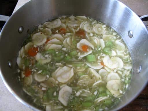 chopped vegetables added to broth
