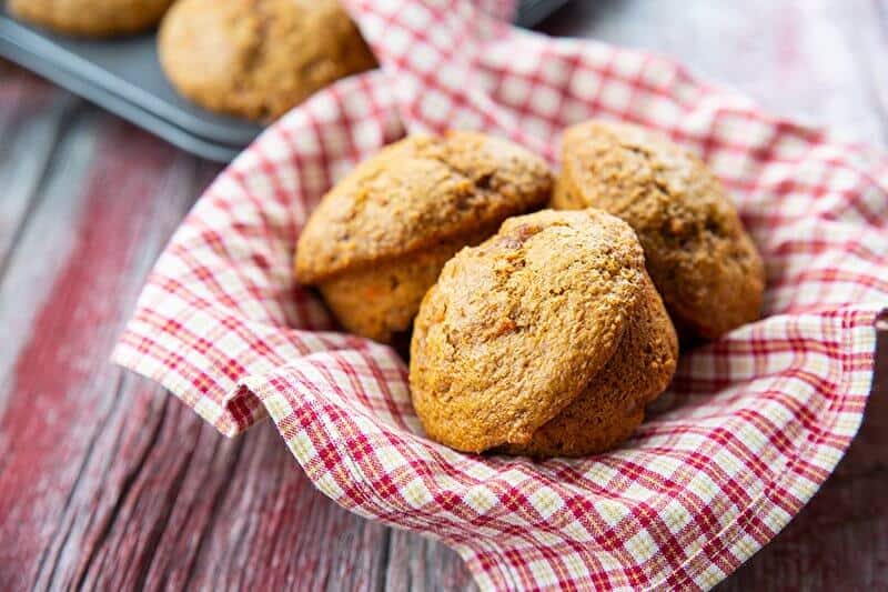 3 pieces Carrot Bran Muffins on a red checkered cloth