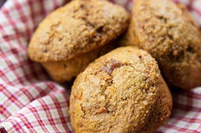 close up of Carrot Bran Muffins on a red checkered cloth