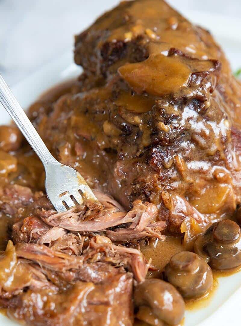 A Fork Pulling Apart a Cooked Chuck Roast