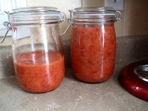 Strawberry freezer jams in two transparent jar with lid