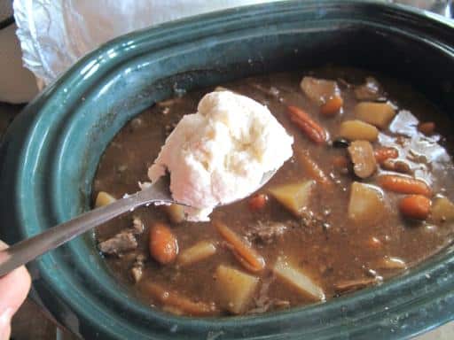 Dropping large tablespoonful of Dumpling batter onto the top of stew/soup concoction in the crockpot