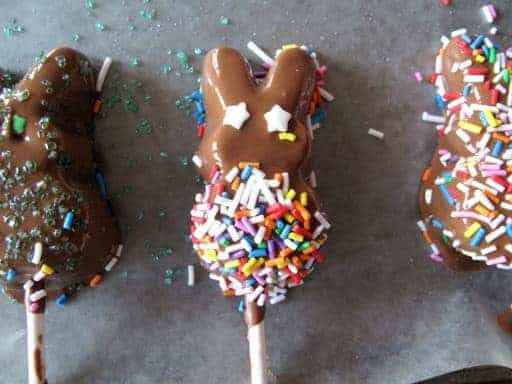 Close up Bunny Marshmallow Peeps with colorful sprinkle and and star shape sprinkles as its eyes