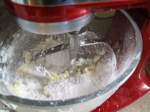Creaming the butter and icing sugar together using a mixer